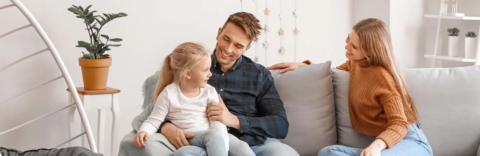 Happy family  sitting in living room