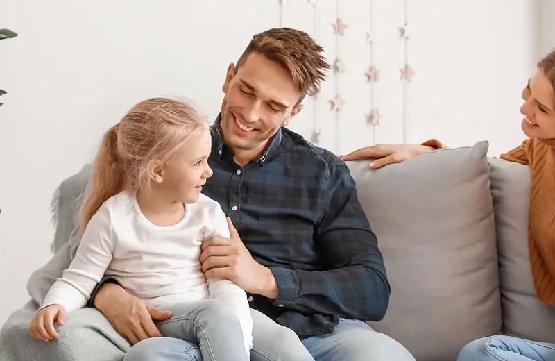 Happy family  sitting in living room